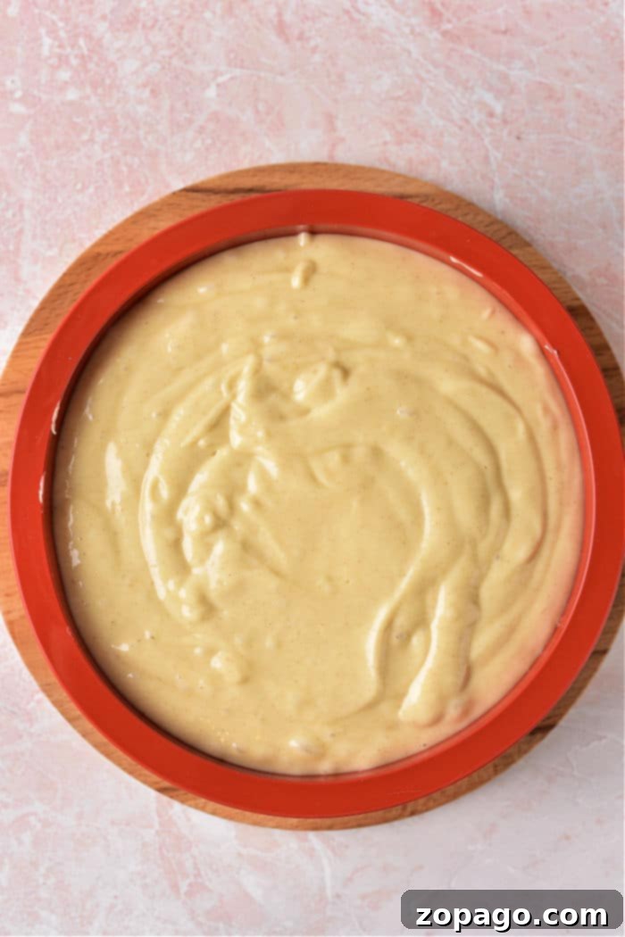 Golden Banana Caramel Flip 5 A beautifully presented banana upside-down cake, perfectly inverted with a golden-brown banana topping.