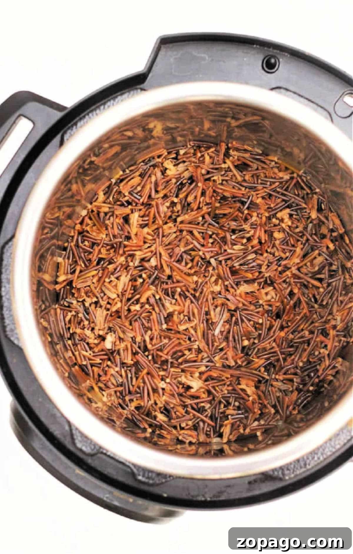 Perfect Instant Pot Black Rice 6 Cooked wild rice and black rice inside an Instant Pot, viewed from above on a white background.