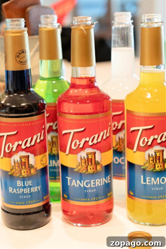 Whip Up a Refreshing Lotus Drink 5 How to Make a Lotus Drink: A close-up of the ingredients – Lotus energy concentrate, Torani syrup, and club soda – laid out for preparation.