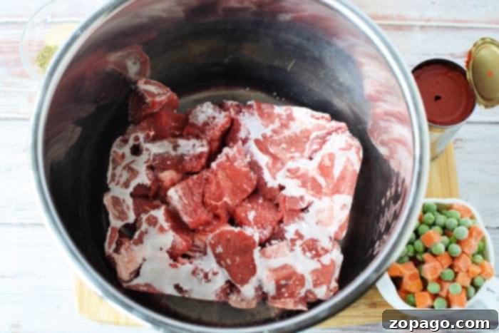 Close-up of frozen beef pieces ready for cooking, illustrating the possibility of cooking beef without thawing.