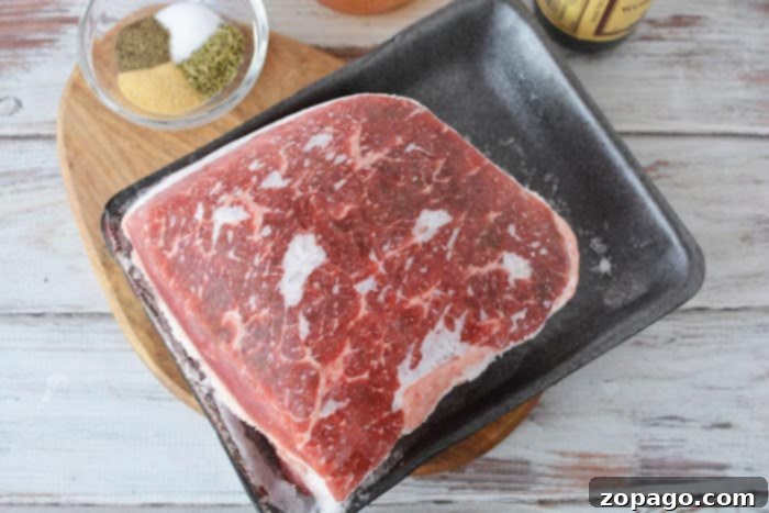 Close-up image of a frozen beef roast, questioning the suitability of boiling.