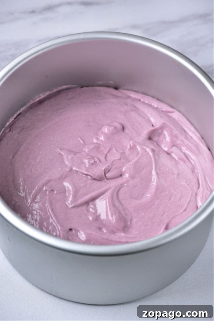 Bake a Vibrant Purple Cake 3 Close-up of a perfectly frosted purple cake, showcasing a vibrant color and smooth finish