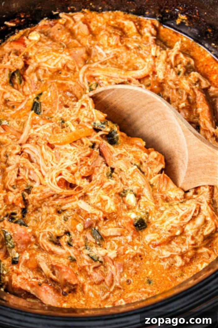 Creamy Poblano Chicken 8 close up of slow cooker shredded chicken with melted cheese