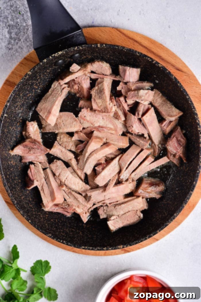 Lengua Tacos 5 Tacos with Cow Tongue, ready to eat, served on a rustic wooden board