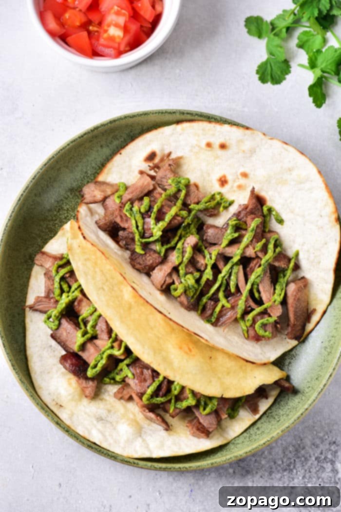 Cooking Tender Beef Tongue 6 A slow cooker filled with a whole cow tongue and ingredients, illustrating the ease of the slow cooker method.
