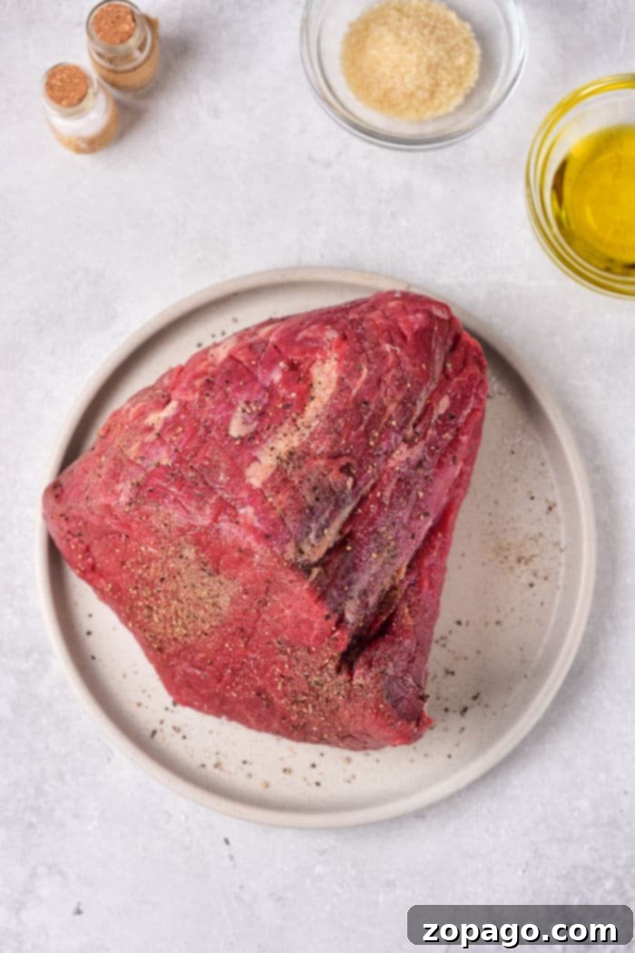 Melt in Your Mouth Tender Roast Beef 3 How to Make a Tender Roast Beef in the Oven - Uncut roast beef with herbs.