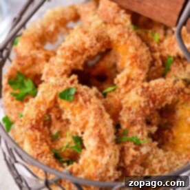 A basket of crispy golden calamari garnished with parsley, reminiscent of Olive Garden's signature appetizers.