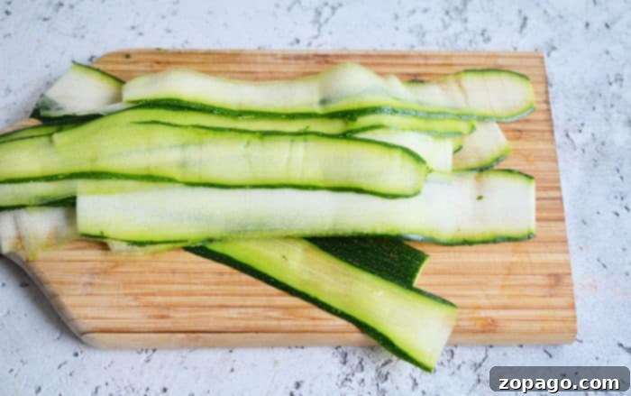 Zucchini Sunshine Eggs 3 Perfectly sliced zucchini strips arranged for baking egg nests.
