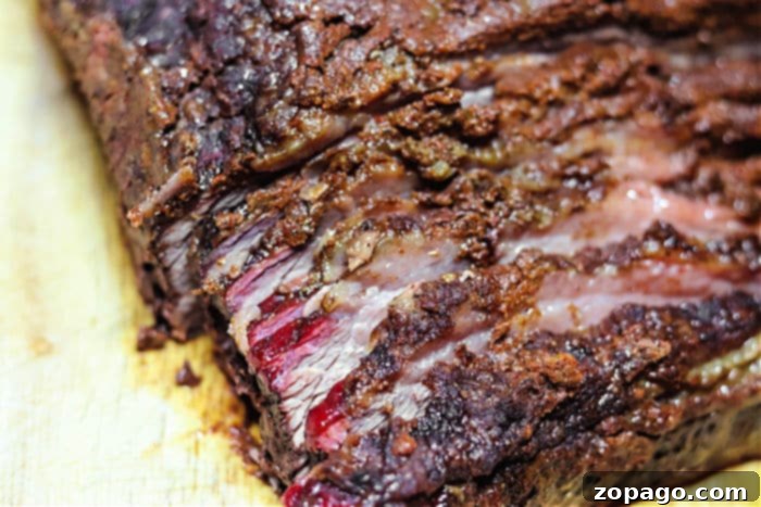 Perfectly Smoked Brisket Flat 5 How Long to Smoke Brisket at 225 - closeup of seasoned brisket