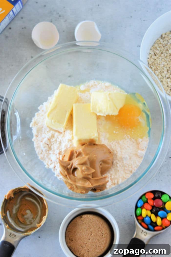 Sheet Pan Cake Mix Cookies 4 Delicious and vibrant Cookie Bars with Cake Mix, baked to a golden brown and studded with colorful candies and chocolate chips.