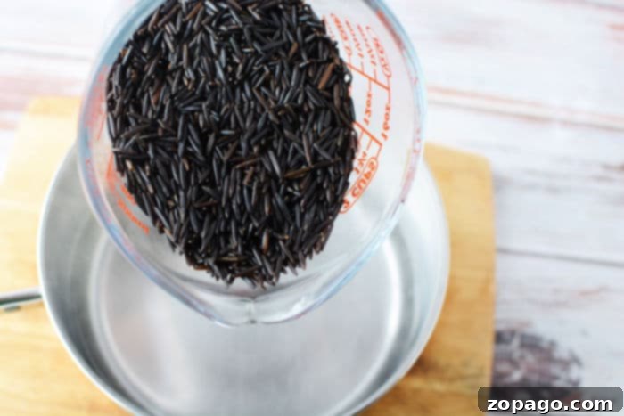 Creamy black rice pudding in a serving bowl, garnished.