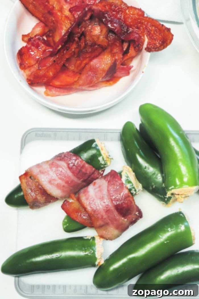 Delicious Smoked Jalapeno Poppers at 350 8 Smoker Bacon Wrapped Jalapeno Poppers on a serving platter, ready to be enjoyed.