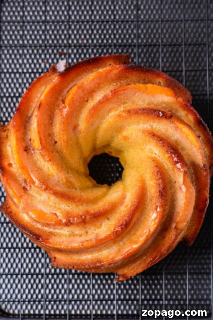 Homestyle Peach Cobbler Pound Cake 6 Beautifully glazed Pound Cake Bundt Cake on a serving plate
