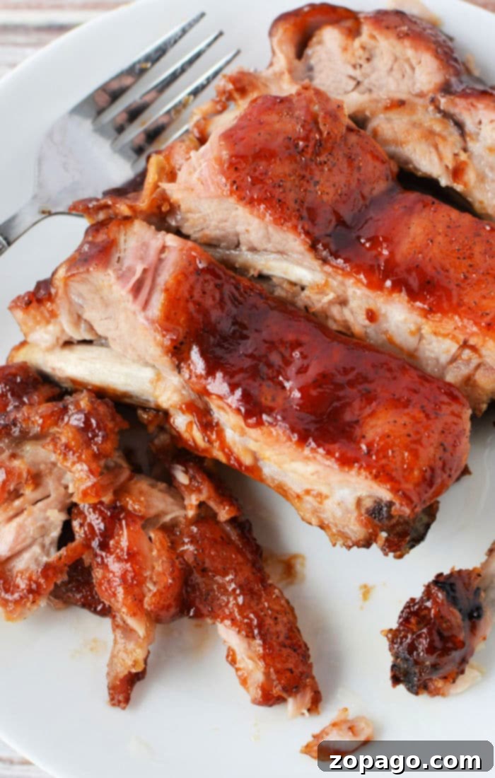 Fall-Off-The-Bone Crockpot Ribs 2 Crockpot ribs cooked with Coca-Cola, perfectly tender and ready to be sauced.