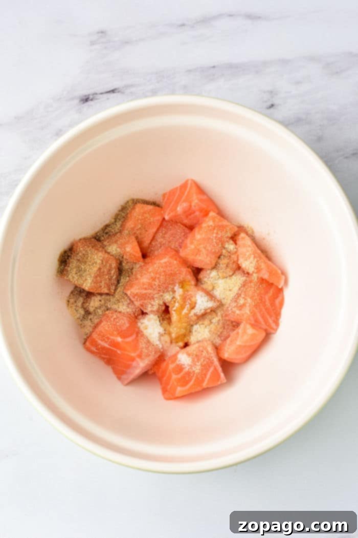 Deliciously fried salmon bites, showcasing a golden brown exterior and tender pink interior.