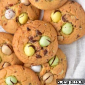 Delicious Dairy-Free Cookies 7 A delightful pile of cookies with colorful chocolate eggs rests on a white cloth, offering a treat for everyone. Discover dairy-free cookie recipes that cater to all, ensuring no one misses out on these vibrant delights.