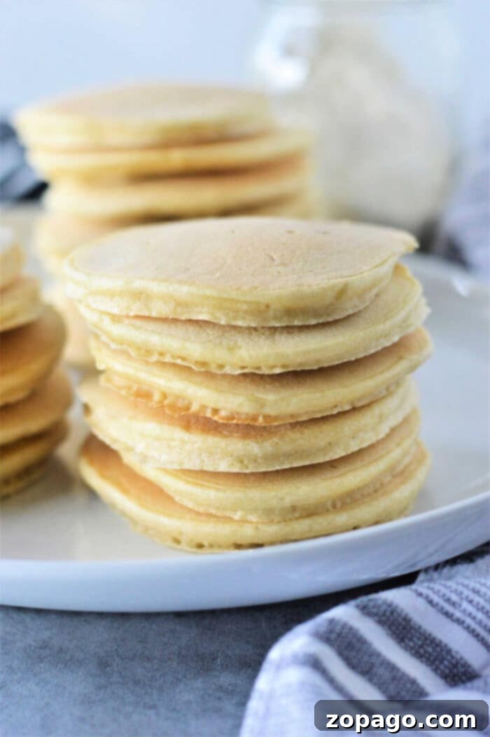 No Baking Powder Pancakes 6 Beautifully stacked golden brown pancakes without baking powder, ready to be served.