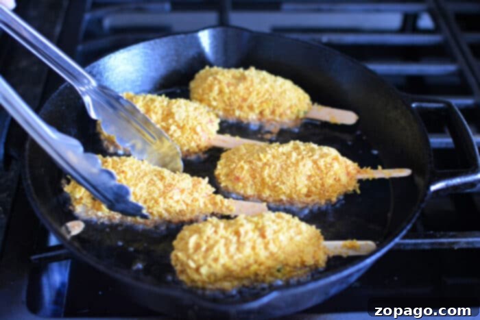 Yalancı Tavuk Butları Nasıl Yapılır 5 Four mock chicken legs frying in a cast iron skillet