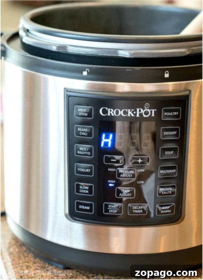 Instant Pot Versus Crock Pot Express The Multicooker Showdown 2 Crock Pot Express electric pressure cooker on a kitchen counter, highlighting its sleek design and user-friendly control panel.