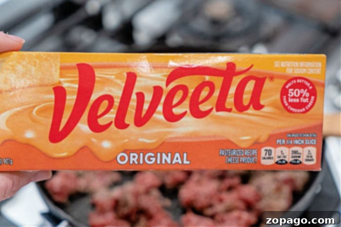Close-up of a creamy Velveeta sausage dip with Rotel, highlighting its smooth texture and appetizing color.