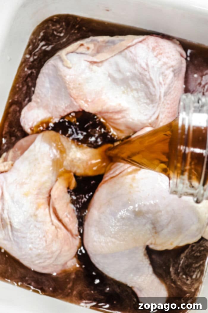 The Ultimate Smoked Chicken Brine 5 Chicken Brine for Grilling – Brined chicken pieces waiting to be grilled, showcasing a beautiful texture.