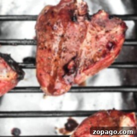 Grilled marinated lamb chops on a barbecue grill