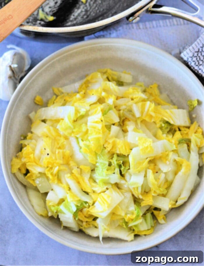 Easy Napa Cabbage Recipes 2 Napa Cabbage Recipe - Freshly sliced Napa cabbage ready for cooking in a skillet.