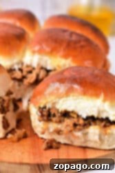 Sloppy Joe sliders on a wooden board with toasted buns