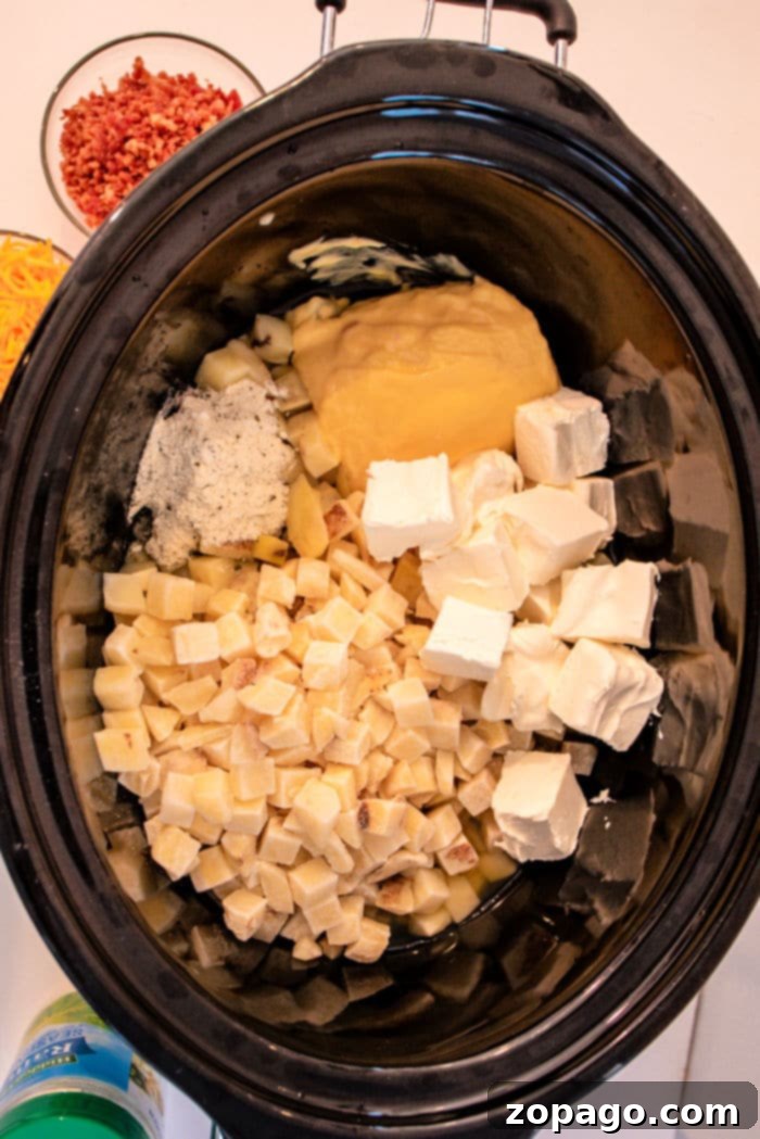 Golden Hashbrown Potato Soup 6 A large pot of Slow Cooker Hashbrown Soup, showing its creamy texture, ready to be served.