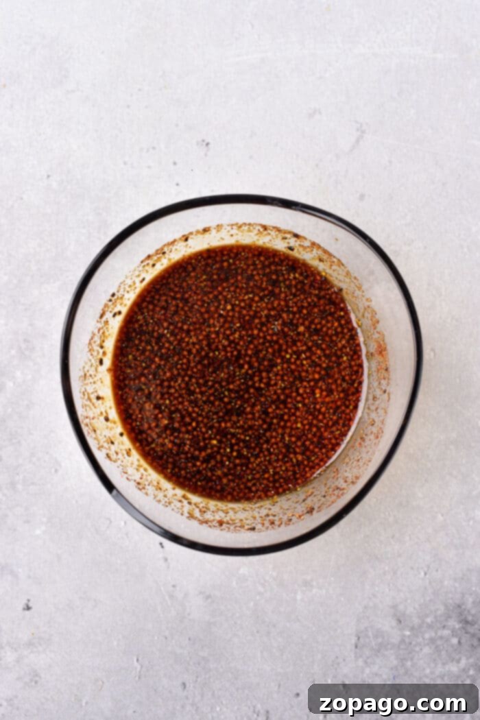 Flavor-Packed Stir Fry Marinade 4 A bowl of the savory and sweet stir-fry marinade, garnished with fresh herbs, highlighting its rich texture.