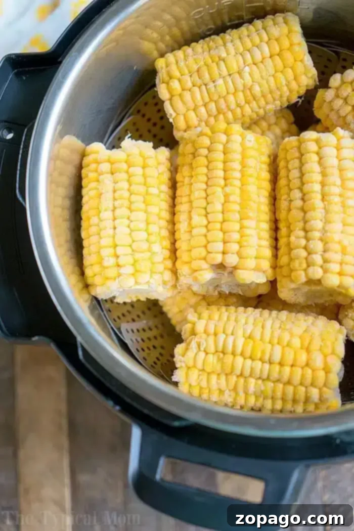 Perfectly Cooked Frozen Corn on the Cob Every Time 5 Instant Pot filled with frozen corn on the cob, ready for pressure cooking