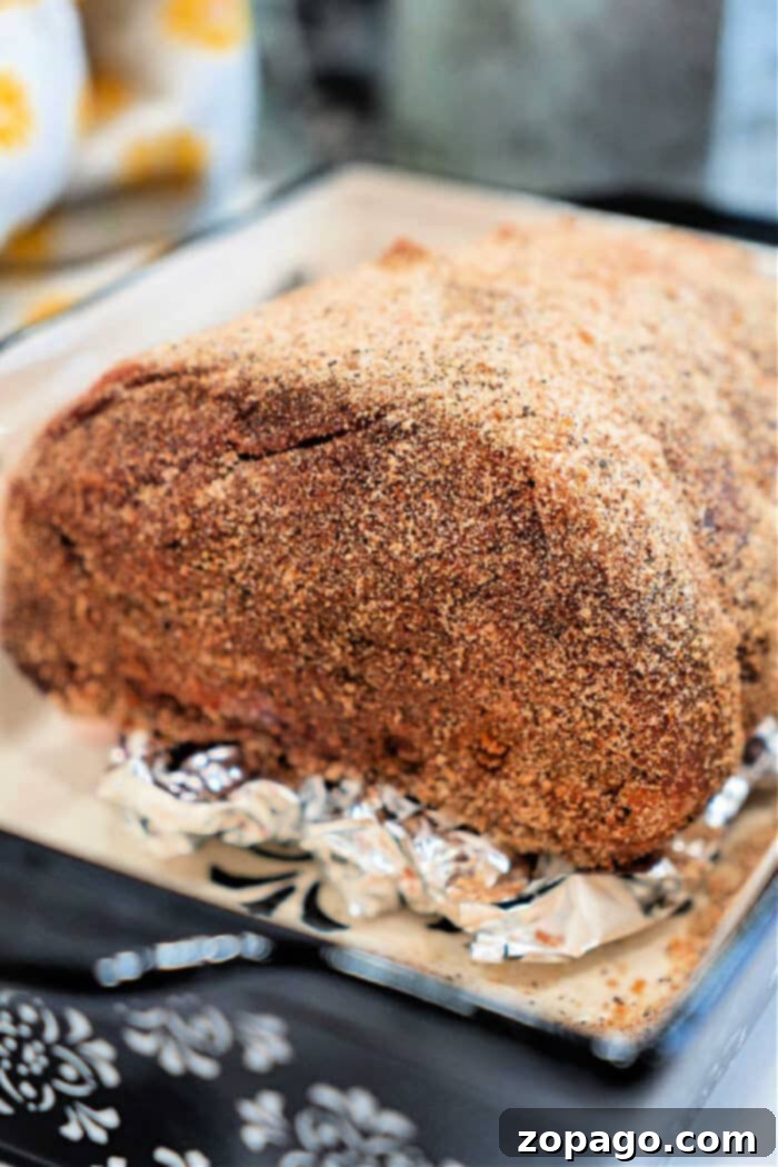 Hearty Top Round Roast 8 Top round roast with dry rub, ready to be carved
