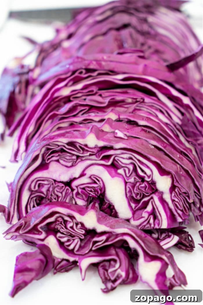 Sweet and Sour Red Cabbage 4 Overhead shot showing how to saute cabbage in a Dutch Oven with garlic and butter.