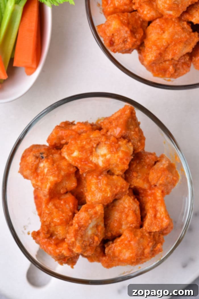 Close-up of golden brown, crispy pan-fried chicken bites.