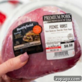 Perfect Pork Picnic Roast 3 A hand holds a packaged Pork Picnic Roast, its label clearly displaying the price and weight.