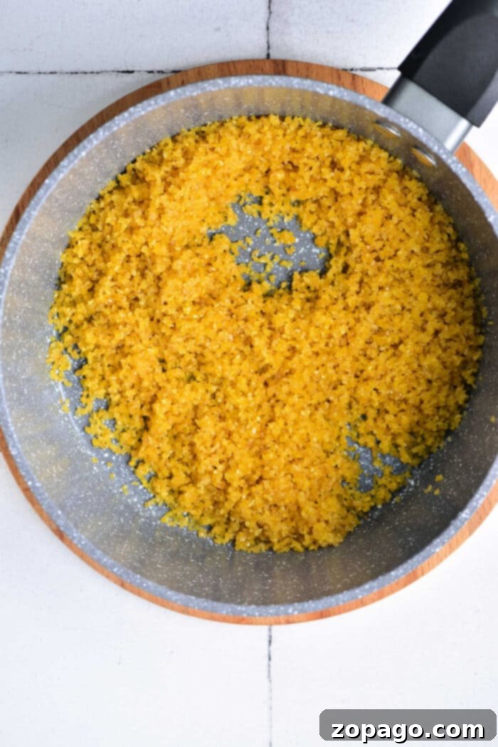 Fluffy Bulgur Every Time 4 A pot of perfectly cooked bulgur wheat, warm and ready to serve, on a rustic wooden board.