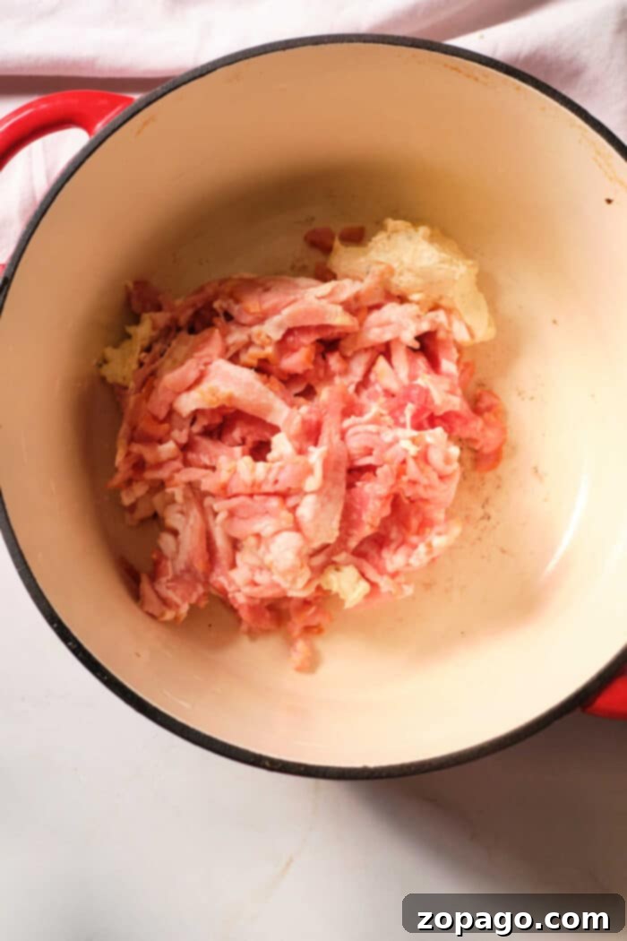 Rustic Cabbage and Bacon 4 Dutch Oven fried cabbage, perfectly cooked to a tender crisp, ready for serving as a delicious side dish.
