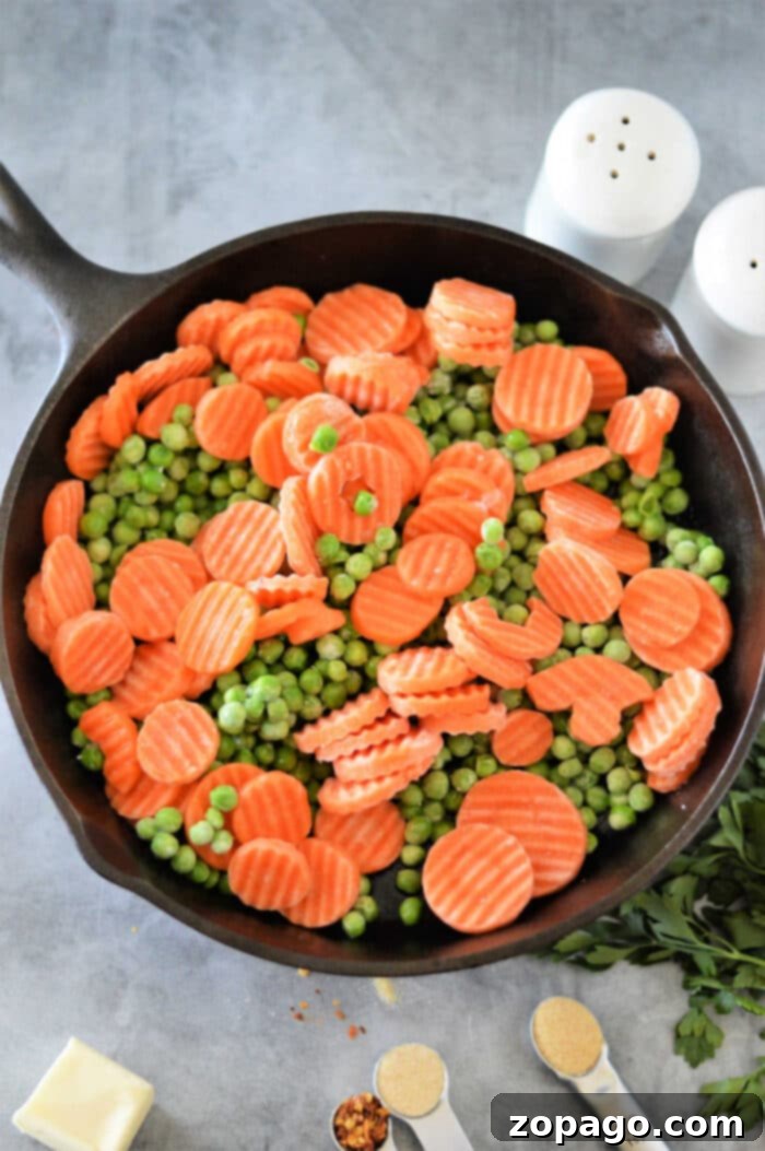 Mastering Frozen Peas and Carrots 4 Frozen peas and carrots in a microwave-safe bowl, ready for quick and easy cooking.
