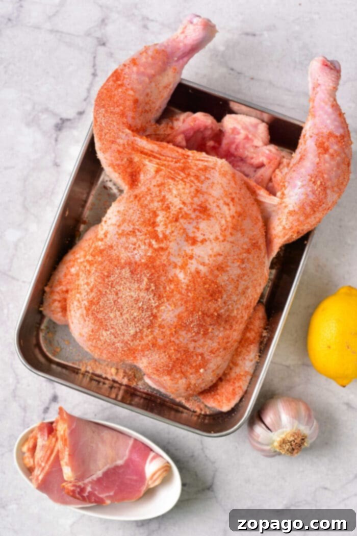 Crispy Bacon-Wrapped Stuffed Chicken 3 Whole Stuffed Chicken in Oven with vegetables