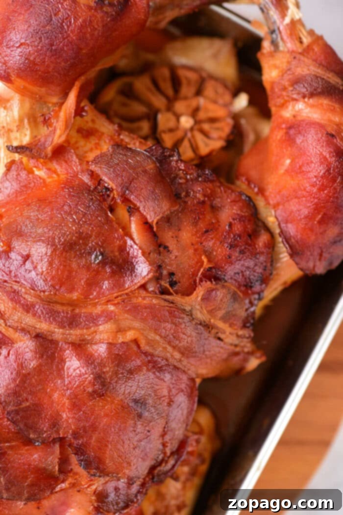 Crispy Bacon-Wrapped Stuffed Chicken 5 Stuffed Chicken Wrapped in Bacon on a platter