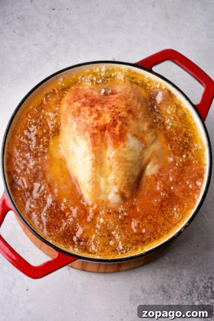 Perfect Chicken Cooking by the Pound 3 Perfectly cooked whole chicken with herbs and lemon, resting after roasting