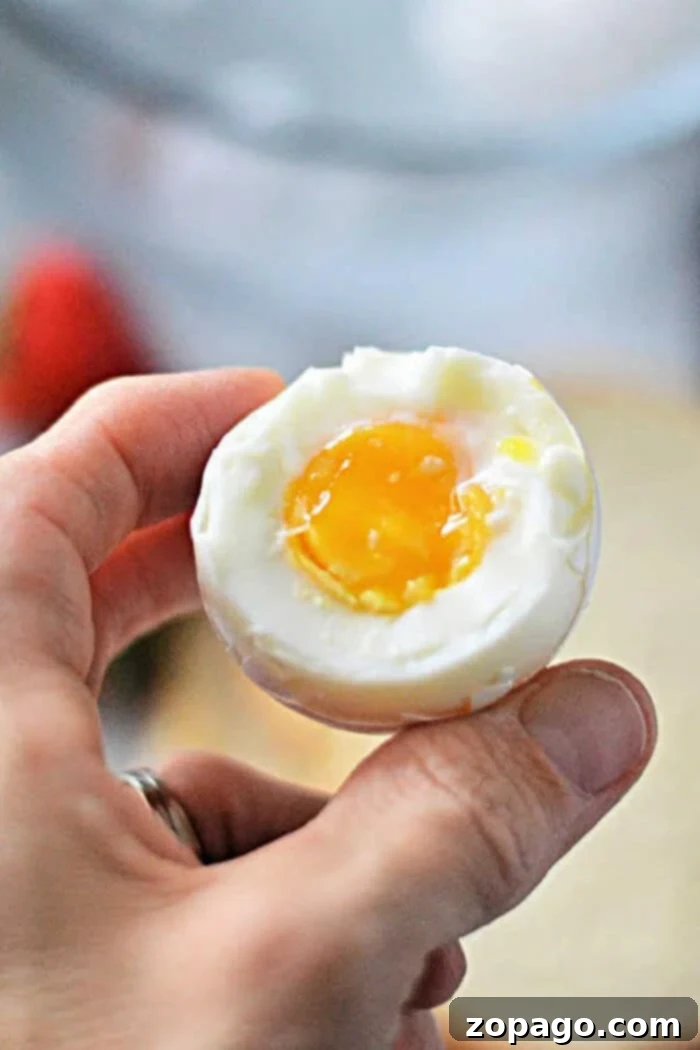Mastering Soft Boiled Eggs 2 How Long to Cook Soft Boiled Eggs - A perfectly cooked soft-boiled egg with a vibrant runny yolk.