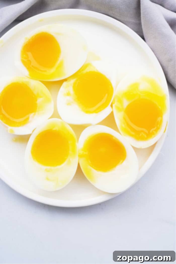 Mastering Soft Boiled Eggs 5 How Long to Cook Soft Boiled Eggs - A close-up of a poached egg with a runny yolk on a plate.