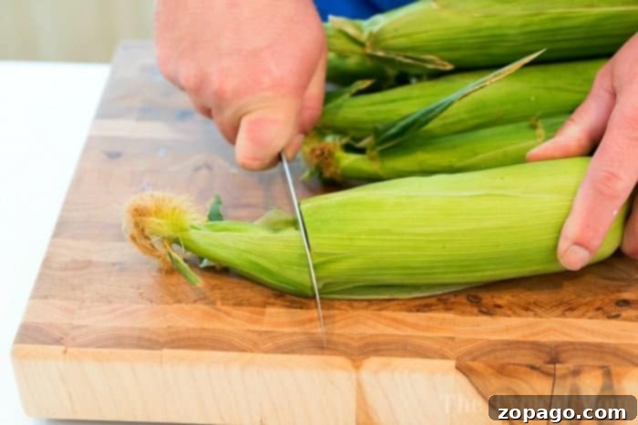 Perfect Microwave Corn on the Cob in Minutes 4 Steaming corn on the cob in the microwave, demonstrating the effectiveness of the husk.