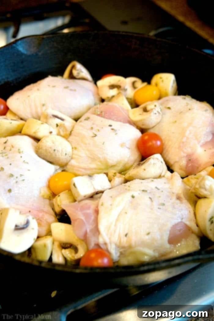 Perfectly Roasted Chicken Thighs: 375°F Cook Time 4 Oven-baked bone-in chicken thighs with roasted herbs, glistening with juices.