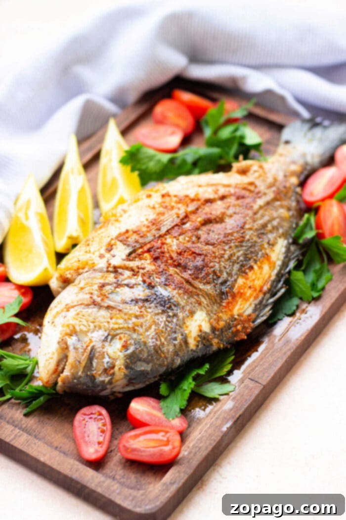Perfectly Crispy Whole Fish 9 A vibrant platter of fried whole fish, garnished with fresh herbs and lemon slices, ready to be enjoyed by the family.