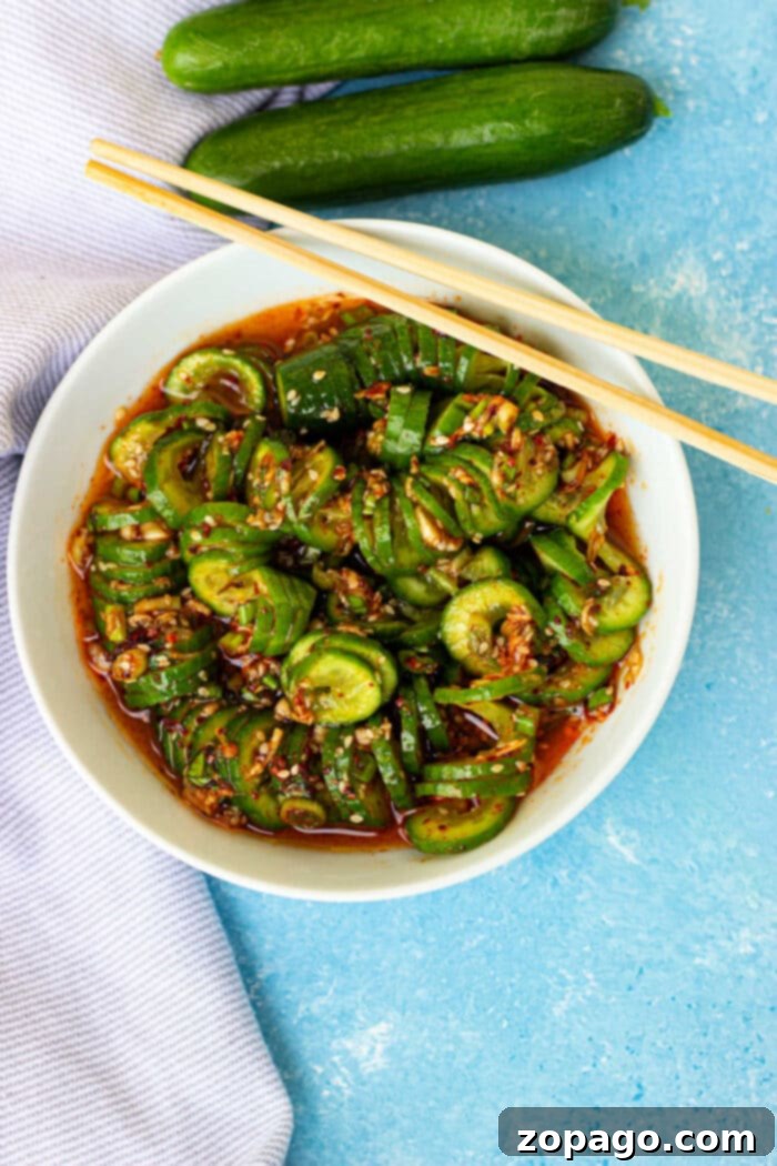 Oi Muchim 5 Spicy Korean Cucumber Salad with a vibrant red dressing and sesame seeds.