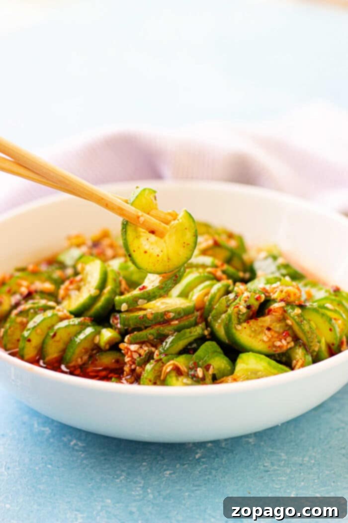 Oi Muchim 6 A colorful cucumber chickpea salad in a serving bowl.