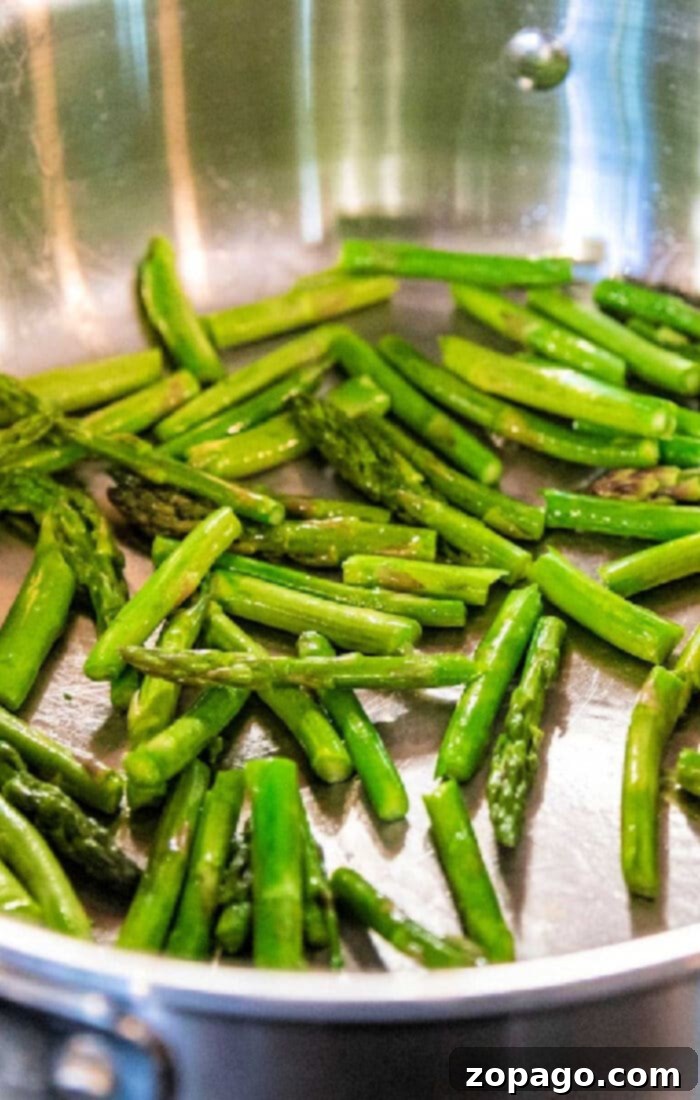 Perfect Pan-Fried Asparagus 2 pan fried asparagus sizzling in a skillet