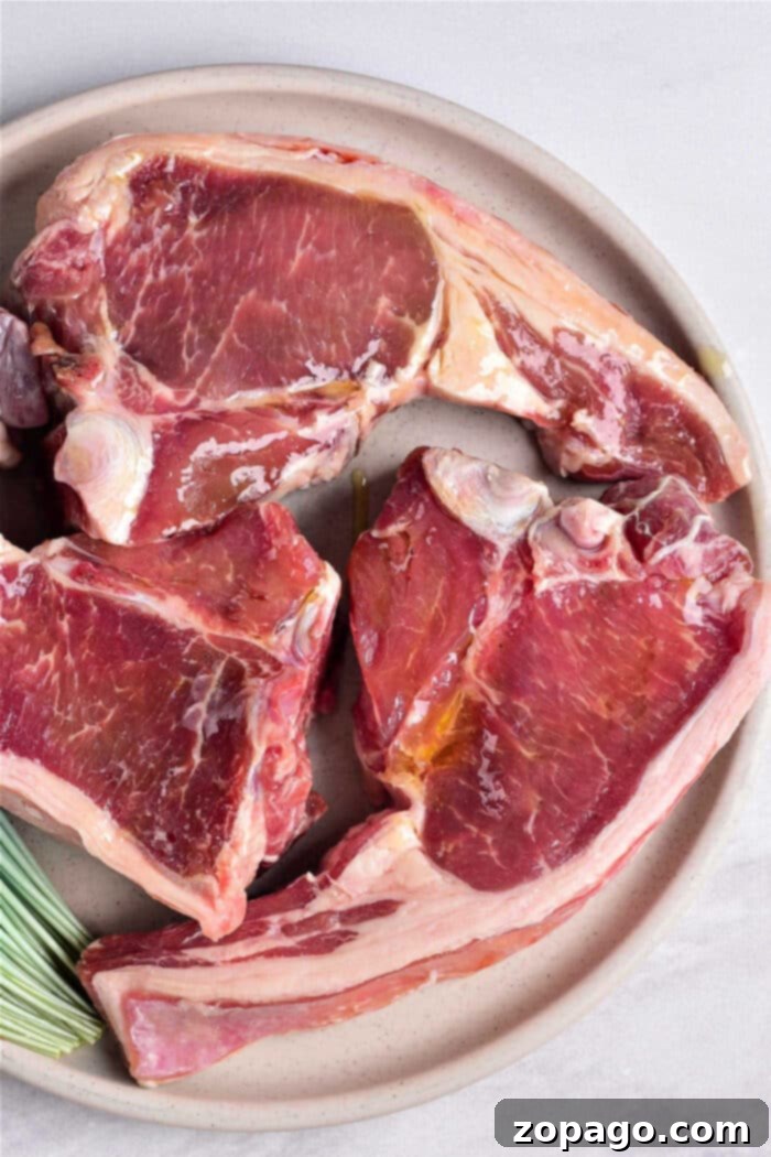 Perfectly cooked lamb chops on a plate, showcasing a beautiful crust and tender interior, inviting you to discover how long to cook lamb chops to perfection.